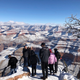 Visitors take photos of a snow-covered Grand Canyon on New Years’ day.